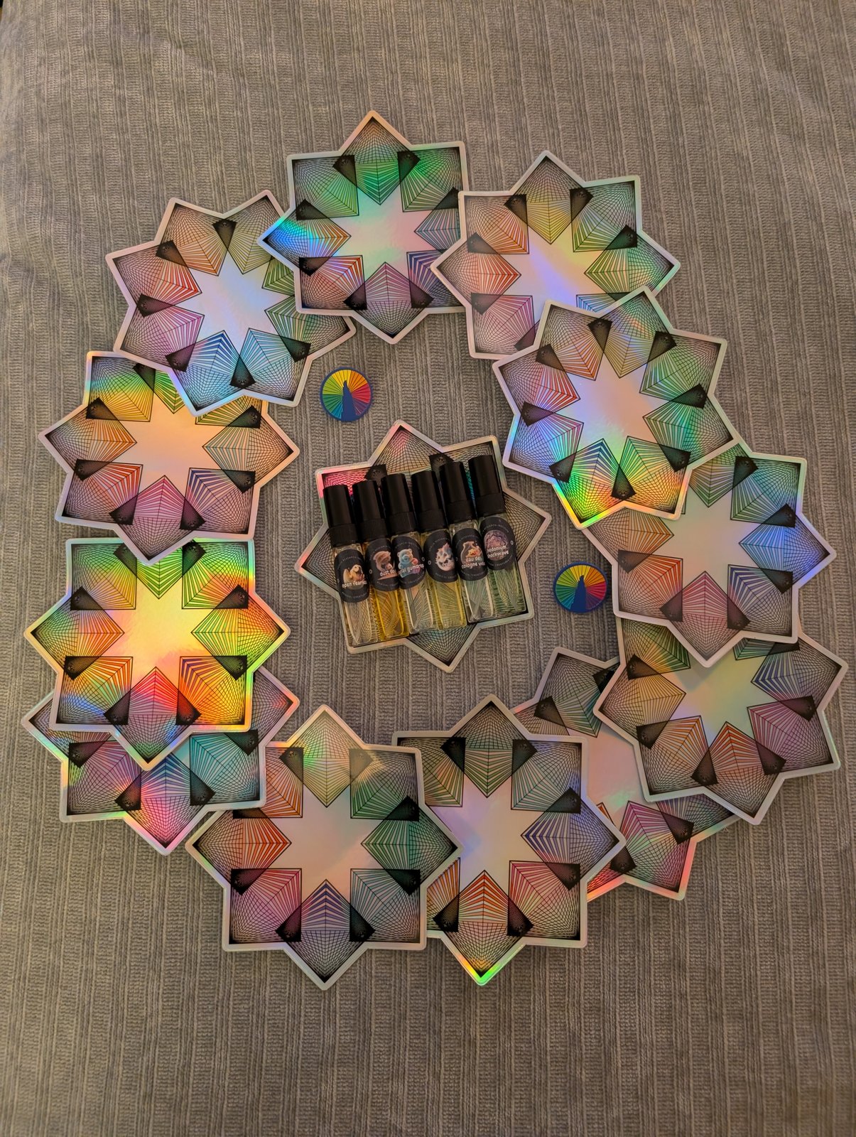 The QRI perfume line on holographic star cards