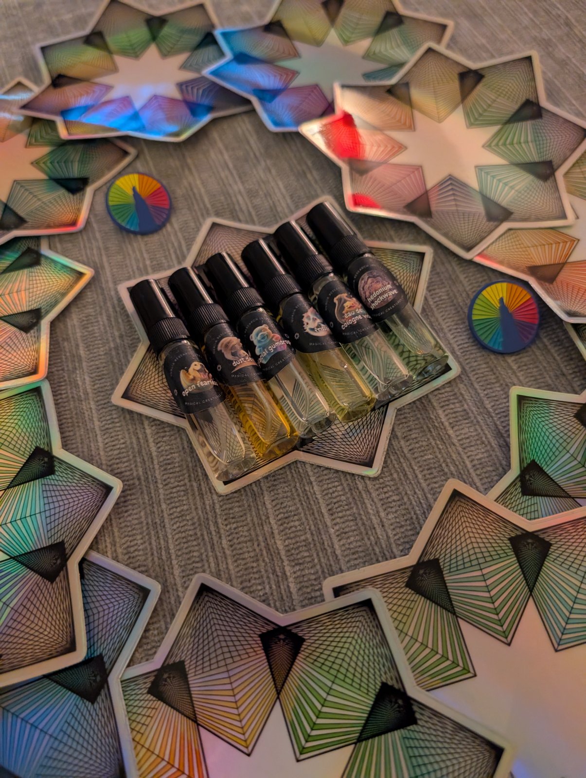 The QRI perfume line on holographic star cards